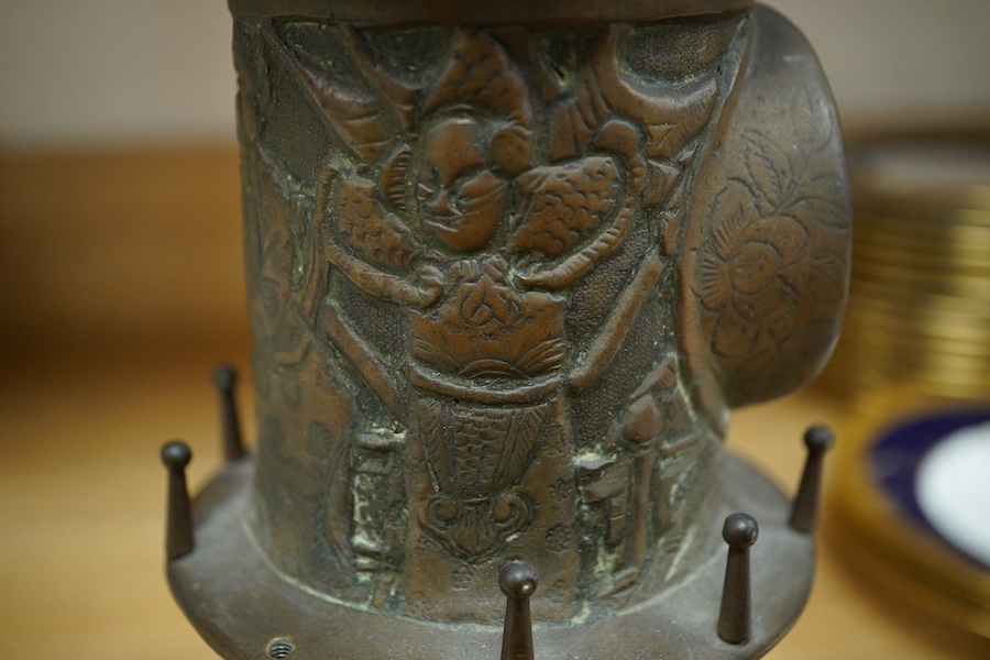 A bronze 'lighthouse' clock case with Chinese repoussé decoration, 30cm. Condition - fair to good